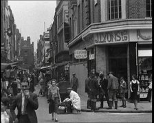 People Walking Past Shops, 1930s. Creator: British Pathe Ltd.