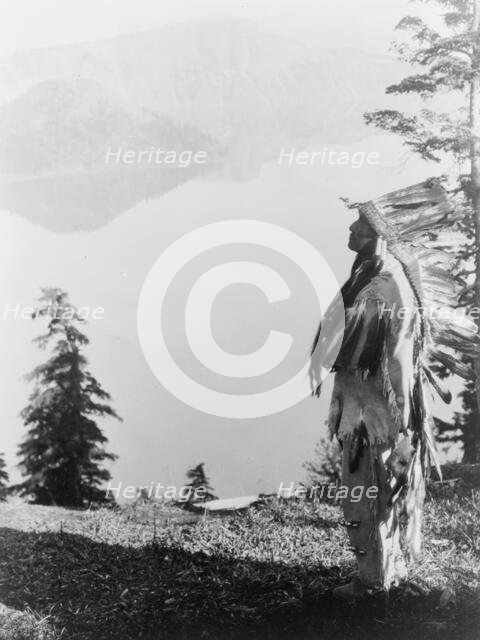 Praying to the Spirits at Crater Lake-Klamath, c1923. Creator: Edward Sheriff Curtis.