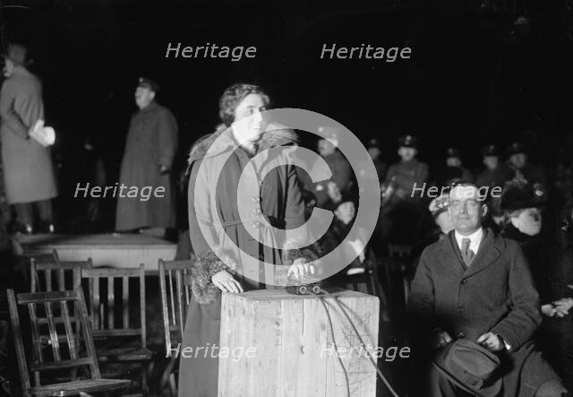 Liberty Loans - Mrs. Mcadoo Lighting Bonfire, 1917. Creator: Harris & Ewing.