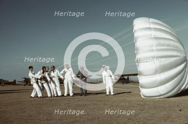 Instructor explaining the operation of a parachute to student pilots, Fort Worth, Tex., 1942. Creator: Arthur Rothstein.
