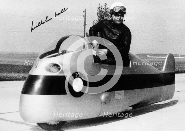 Wilhelm Noll on a 500cc BMW motorcycle, 1955. Artist: Unknown