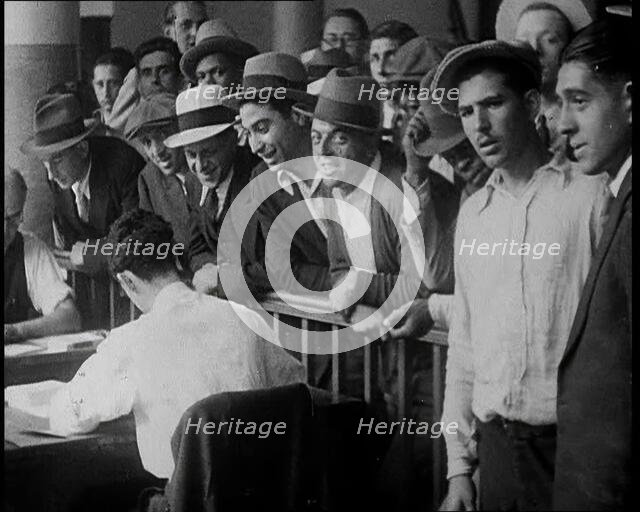 A Crowd of People Inside an Employment Agency Asking For Work, 1932. Creator: British Pathe Ltd.