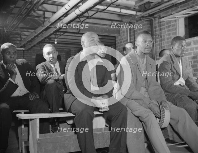 Air raid wardens' meeting in zone nine, Southwest area, Washington, D.C, 1942. Creator: Gordon Parks.
