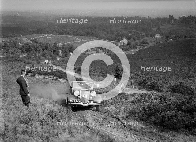 3622 cc Ford V8 tourer taking part in the NWLMC Lawrence Cup Trial, 1937. Artist: Bill Brunell.