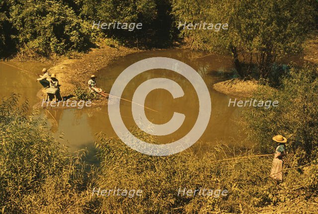 Negroes fishing in creek near cotton plantations outside Belzoni, Miss. Delta, 1939. Creator: Marion Post Wolcott.