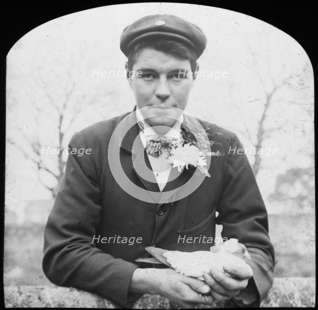 E Hack holding a pigeon, late 19th or early 20th century. Artist: Unknown