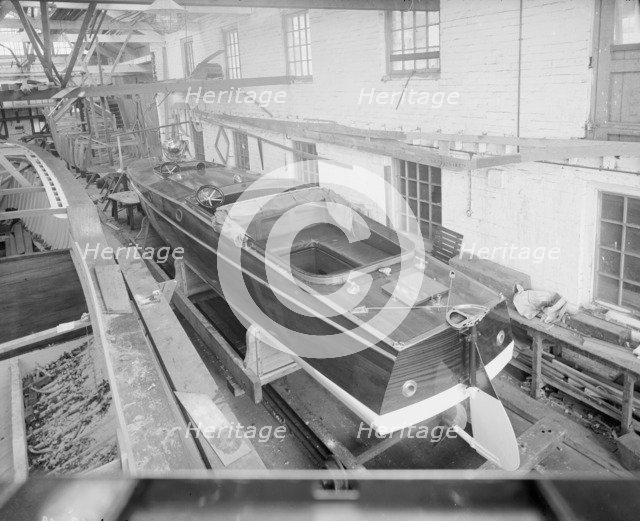 Motor launch in boatyard shed, 1913. Creator: Kirk & Sons of Cowes.
