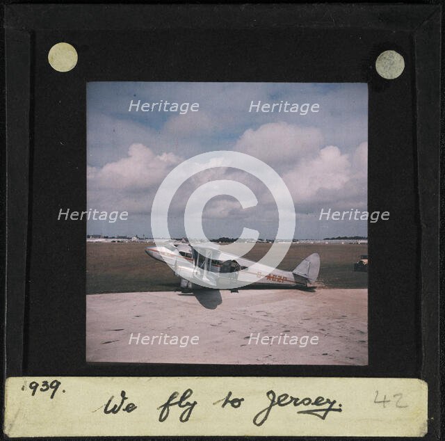 The Guernsey and Jersey Airways de Havilland D H 86 Express G-ACZP on a runway, perhaps at..., 1939. Creator: Norman Kingsley Harrison.