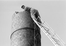 steeplejack up a 6 metre high chimney, Landskrona, Sweden, 1967. Artist: Unknown