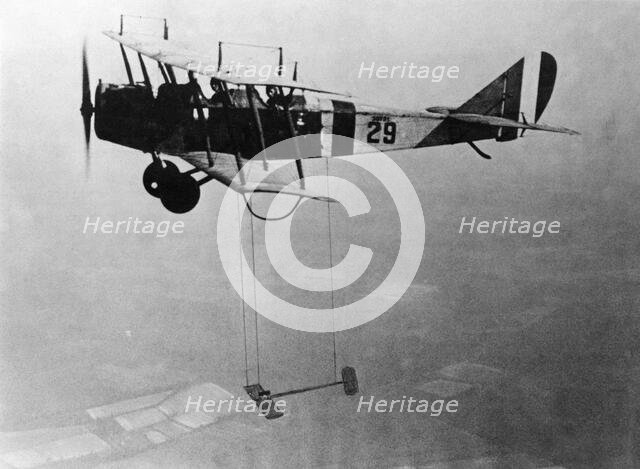 Curtiss JN-4 "Jenny" aircraft with model wing suspended, June 22, 1921. Creator: Unknown.
