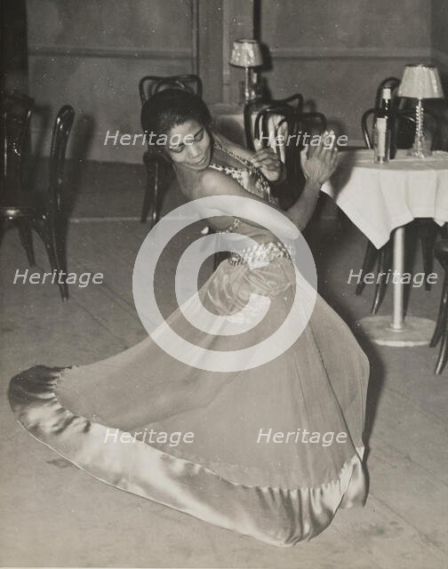 Zola King, eccentric dancer doing her nightly stunt in the cabaret scene, 1937. Creator: Unknown.