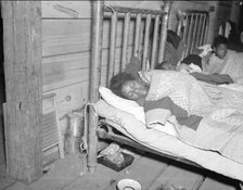 Sick flood refugee in the Red Cross temporary infirmary at Forrest City, Arkansas, 1937. Creator: Walker Evans.