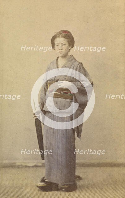 Woman with closed parasol, about 1868. Creator: Felice Beato.