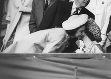 Queen Elizabeth II greets Princess Margaret in the Royal Box, Wimbledon, July 1962. Artist: Unknown