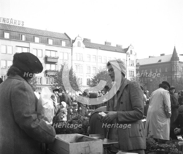 Scene in the market, Malmö, Sweden, 1947. Artist: Otto Ohm