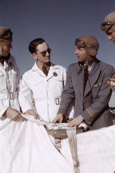 Instructor explaining the operation of a parachute to student pilots, Fort Worth, Tex., 1942. Creator: Arthur Rothstein.
