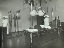 A patient undergoes a medical procedure, c1950s. Creator: Unknown.