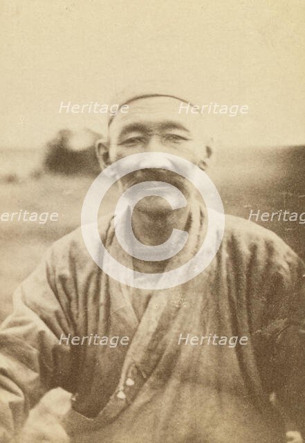 Half-length portrait of man, seated facing front, between 1870 and 1886. Creator: Unknown.