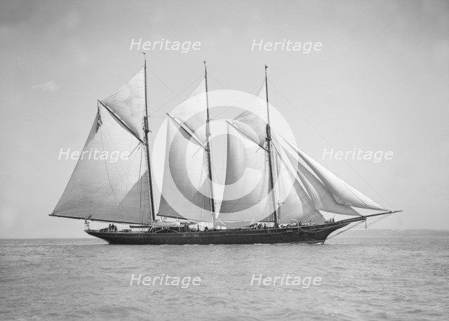 The three-mast auxiliary schooner 'Invincible', 1911. Creator: Kirk & Sons of Cowes.