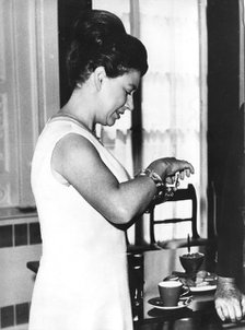 Princess Margaret adds sweetener to a cup of coffee, Belgrave Square, London, 1971. Artist: Unknown