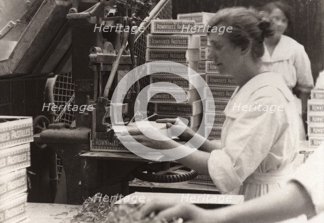 Nailing machine, Rowntree factory, York, Yorkshire, 1920. Artist: Unknown