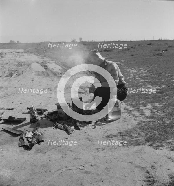Along a California highway, a dust bowl refugee bound for Oregon, 1937. Creator: Dorothea Lange.