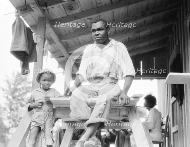 Evicted Arkansas sharecropper, now building his new home at Hill House, Mississippi, 1936. Creator: Dorothea Lange.