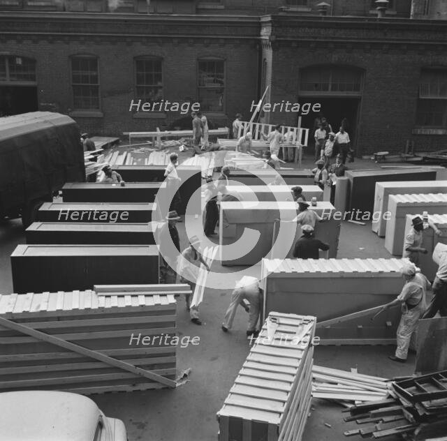Possibly: United States government workers and carpenters making crates..., Washington, D.C., 1942. Creator: Gordon Parks.