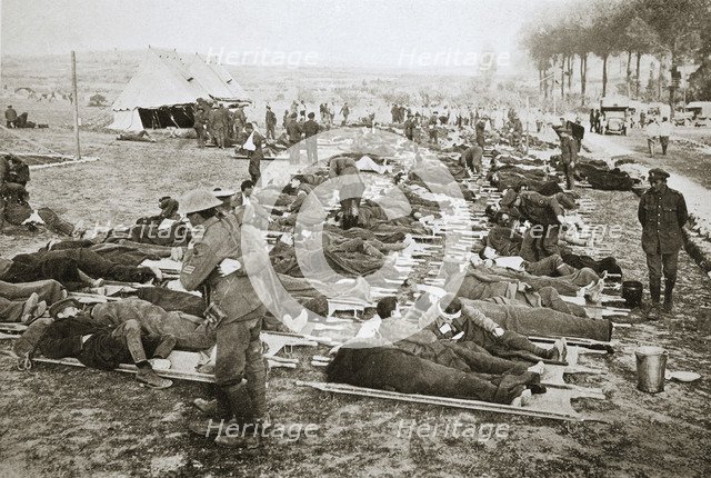 Wounded men waiting to be taken away to a clearing station, France, World War I, 1916. Artist: Unknown