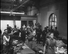 British Soldiers Receiving New Uniforms Back at Camp, 1940. Creator: British Pathe Ltd.