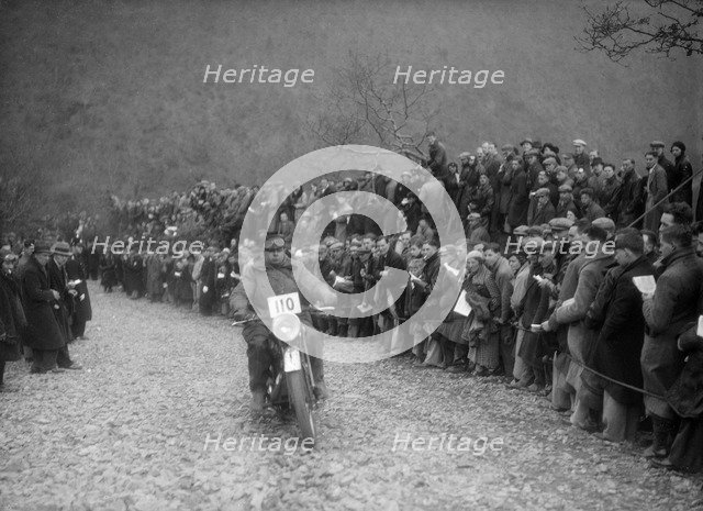 347 cc AJS of J Hey competing in the MCC Lands End Trial, Beggars Roost, Devon, 1936. Artist: Bill Brunell.