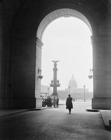 U.S. Capitol - View Through Arch At Union Station, 1917.  Creator: Harris & Ewing.