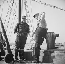 New England fishermen resting on the Fulton docks, New York, 1943. Creator: Gordon Parks.