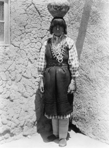 Shuati-Sia. Full-length portrait of a woman standing, facing front, with pot on head, c1926. Creator: Edward Sheriff Curtis.