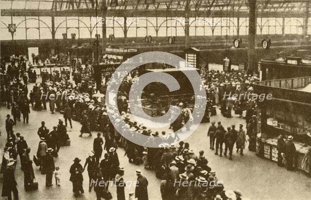 'A Queue of Holiday-Makers Waiting for Trains at Waterloo Station, London', 1930. Creator: Alfieri.