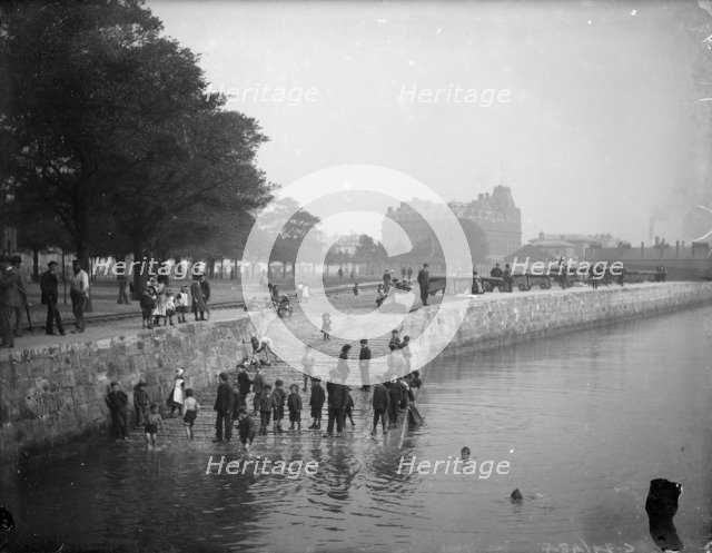Children play ducks and drakes in the River Itchen, Southampton, Hampshire, c1878. Artist: Henry Taunt