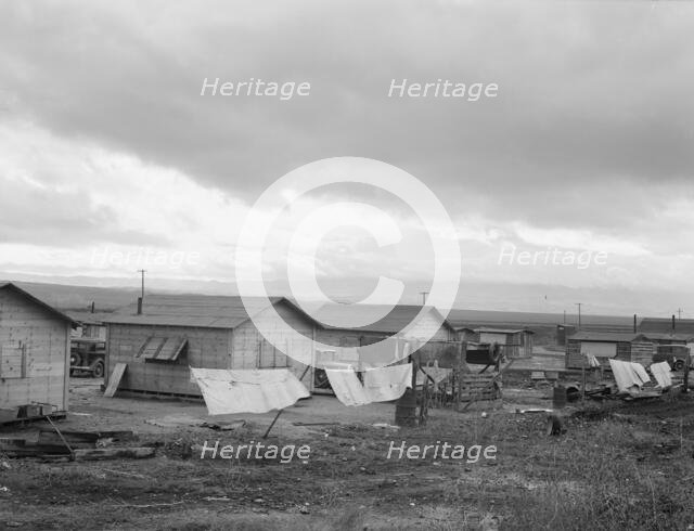 "Company" cotton pickers' camp after picking season, Buttonwillow, California , 1939. Creator: Dorothea Lange.