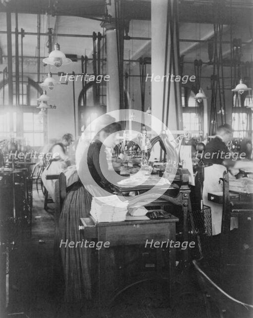 Women operating machinery at the Bureau of Printing and Engraving, Washington, D.C., 1889 or 1890. Creator: Frances Benjamin Johnston.