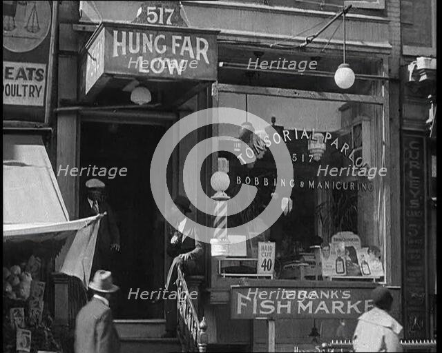 American Civilians Outside a Bobbing and Manicure Parlour, 1930s. Creator: British Pathe Ltd.