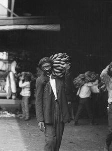 Unloading bananas, New Orleans, between 1920 and 1926. Creator: Arnold Genthe.
