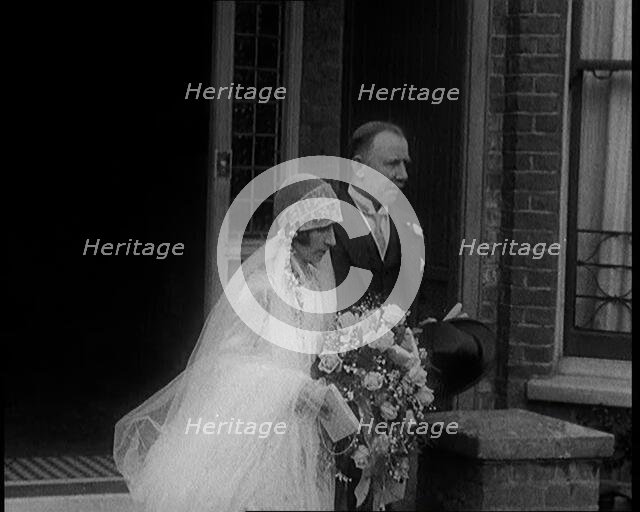 John Henry Thomas and His Daughter Emerging from a Building, 1924. Creator: British Pathe Ltd.