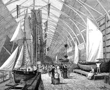 The International Fisheries Exhibition: boats and nets in the British Sea Fisheries Gallery, 1883. Creator: John Greenaway.