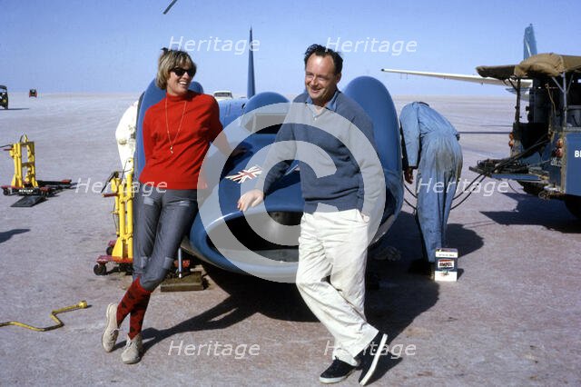 Donald Campbell with his wife Tonia and Bluebird CN7, Lake Eyre, Australia, 1964. Creator: Unknown.