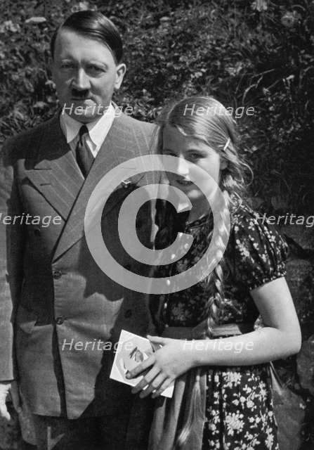 A young girl asks Adolf Hitler for his autograph, 1936. Artist: Unknown