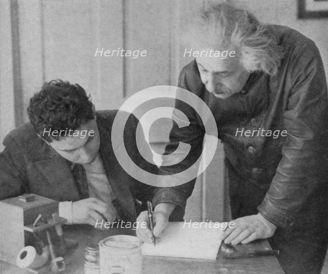 Albert Einstein, German-Swiss-American mathematician and physicist, with a student. Artist: Unknown