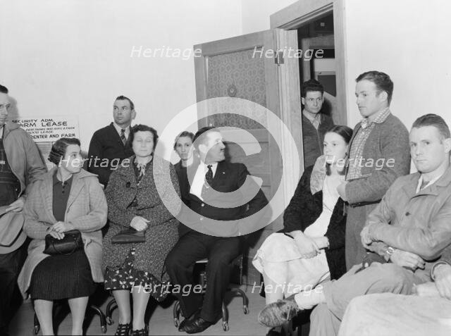 Night meeting in the FSA office, Tulare County, California, 1938. Creator: Dorothea Lange.