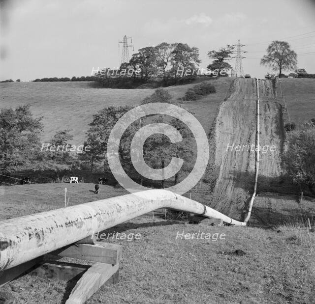 Mersey oil pipeline..., showing the pipeline after the welders have passed..., 24/09/1967. Creator: John Laing plc.