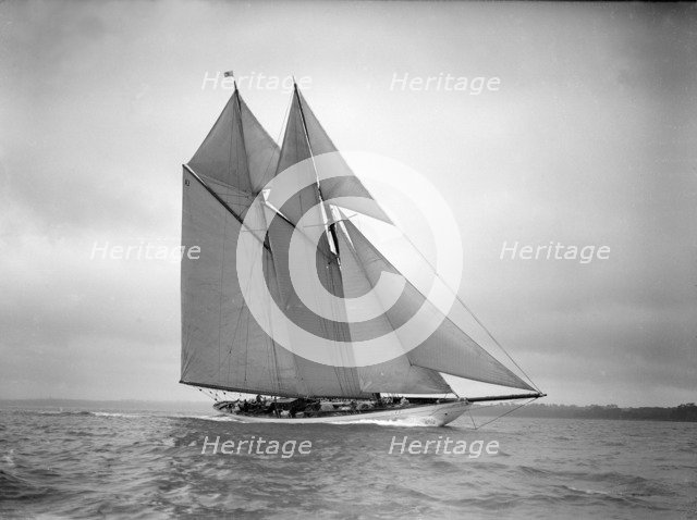 The 250 ton schooner 'Germania' sails close-hauled, 1911. Creator: Kirk & Sons of Cowes.