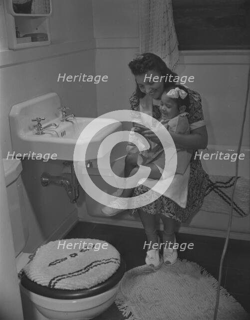 Mother and her daughter, Frederick Douglass housing project, Anacostia, D.C., 1942. Creator: Gordon Parks.