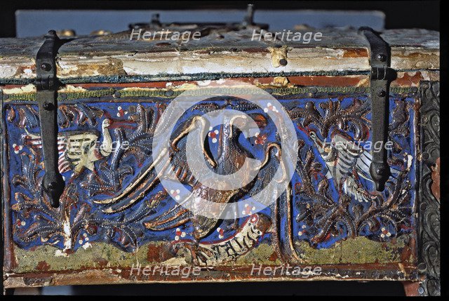 Detail of a chest made in painted wood, decorated with an eagle with two white birds in polychrom…